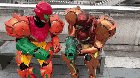 Samus cosplayers comparing blasters