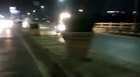 Bikers try to chase down a runaway horsecart. Pune, India.